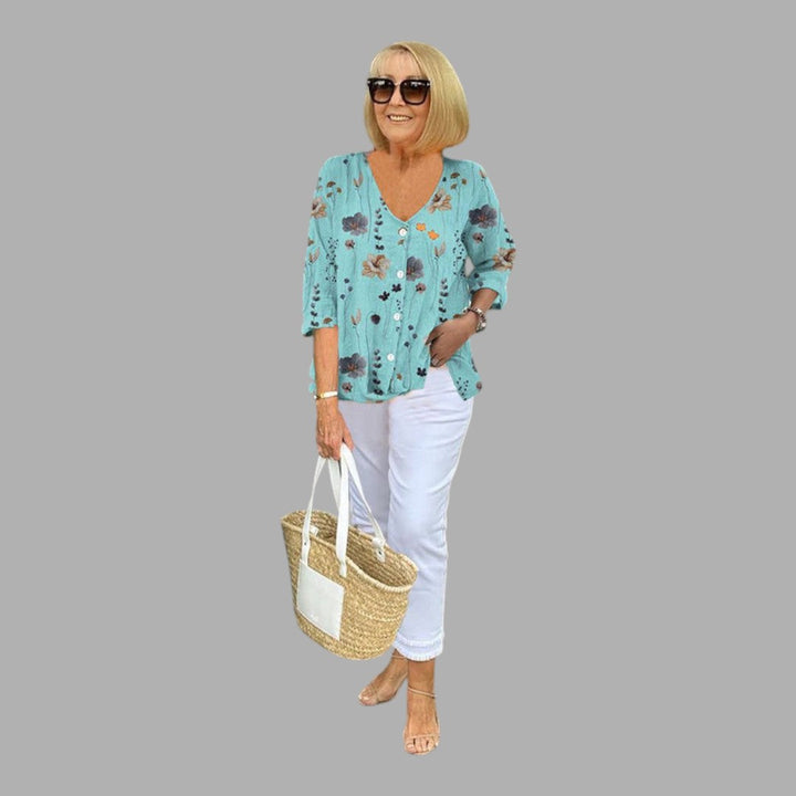 Elegant women's long sleeve floral blouse, perfect for semi-formal office wear or spring casual chic fashion. Feminine top.