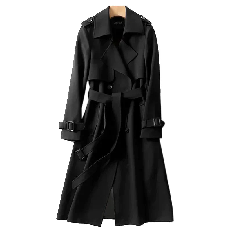 Women's long trench coat featuring a stylish double-breasted front and a flattering tie belt. Fall outerwear.