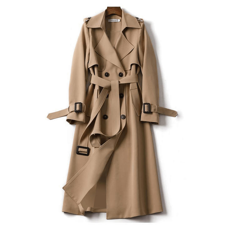 Fashionable women's long trench coat with double-breasted front and tie belt. Elegant fall fashion & office wear.