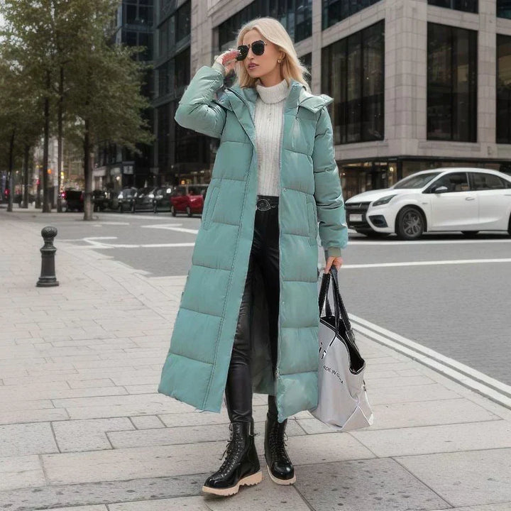 Classic women's long winter coat, essential for cold weather, sleek & elegant.