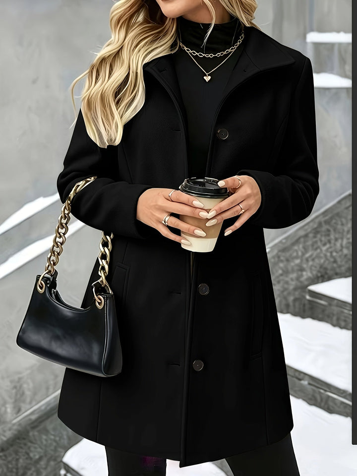 Versatile women's elegant longline winter coat, suitable for office or stylish cold weather fashion.