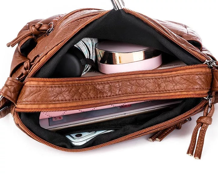 Stylish women's soft leather shoulder bag, convertible to crossbody. Luxurious & durable leather handbag.