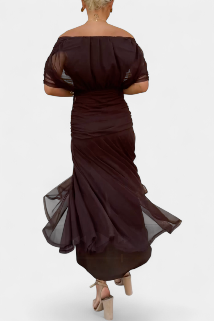Formal women's long dress, ideal for wedding guests, with a stylish pleated wrapped waist.