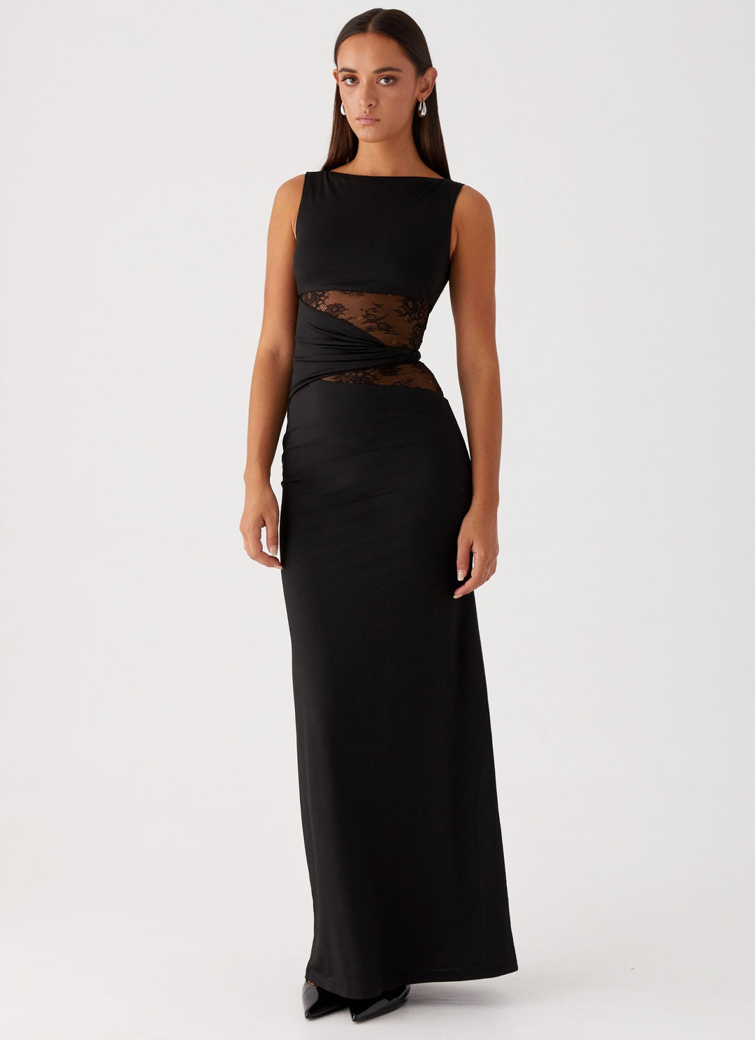 Elegant women's maxi dress with boat neck, sleeveless design, and delicate lace cut-out details, perfect for formal events.