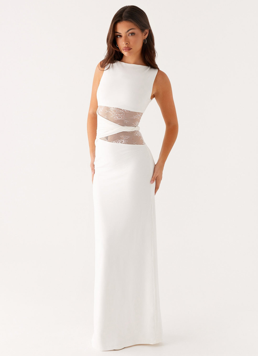 Women's sophisticated black maxi dress. Elegant boat neck, sleeveless cut, and lace cut-out design, perfect for evening wear.
