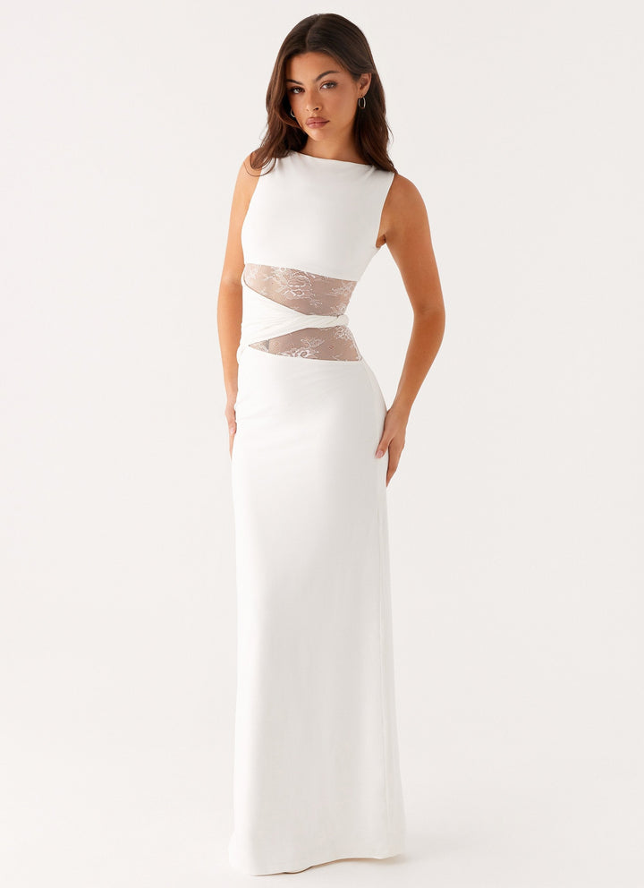 Women's sophisticated black maxi dress. Elegant boat neck, sleeveless cut, and lace cut-out design, perfect for evening wear.