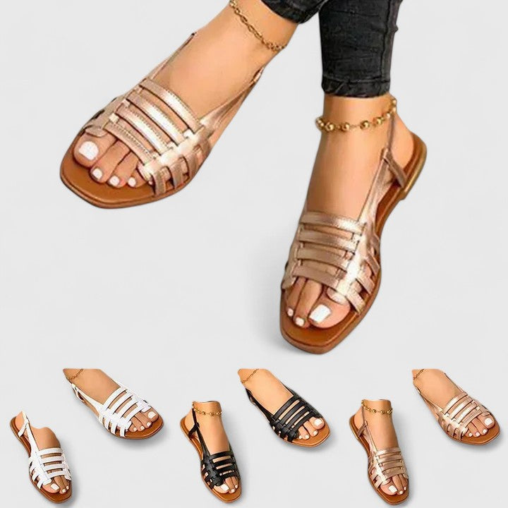 Elegant women's metallic woven flat sandals with open toe and slingback strap, perfect for summer comfort and versatile style.