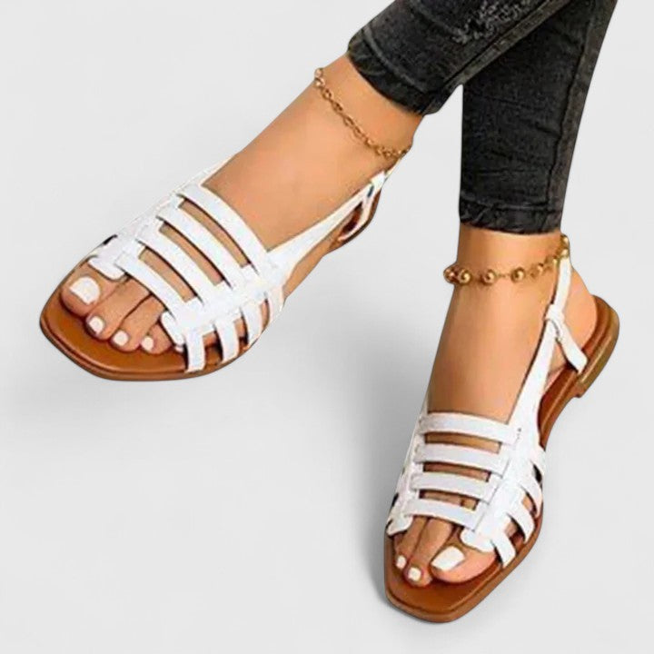 Chic metallic woven flat sandals for women, featuring an open toe and slingback, ideal for warm weather and casual elegance.