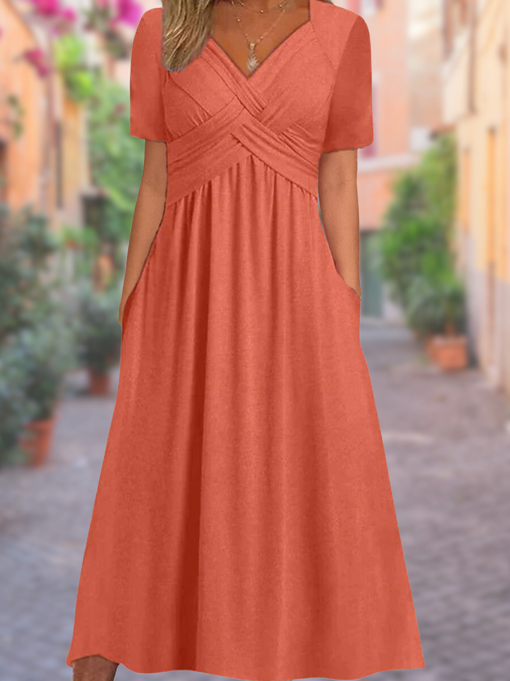 Elegant women's midi dress featuring a stylish V-neck and unique crisscross bodice. Perfect for versatile wear.