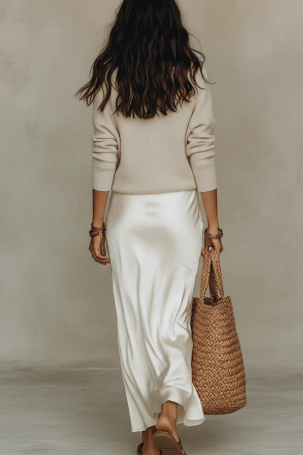 Stylish two-piece women's midi dress and sweater set, offering versatile fashion for any elegant occasion.