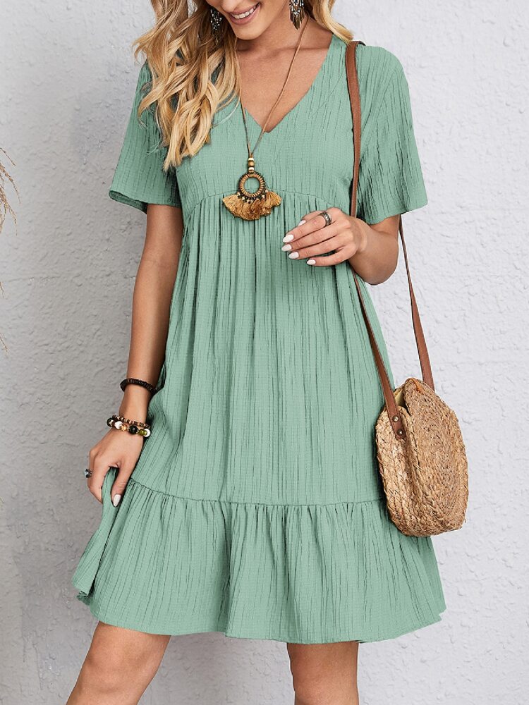 Versatile women's midi dress. Elegant and comfortable, featuring a flattering fit and chic belly coverage.