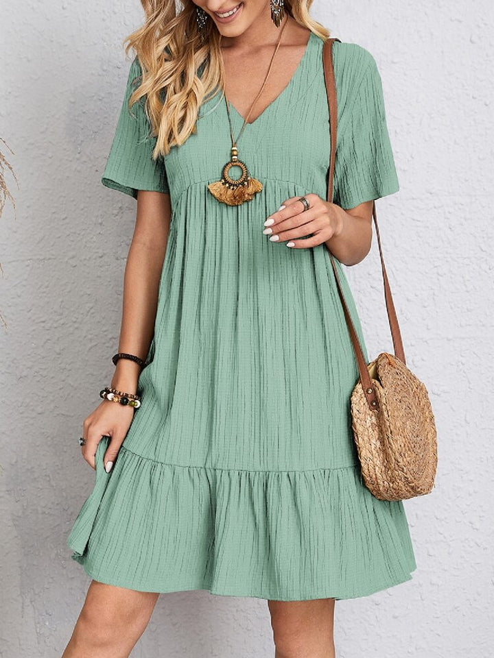 Versatile women's midi dress. Elegant and comfortable, featuring a flattering fit and chic belly coverage.