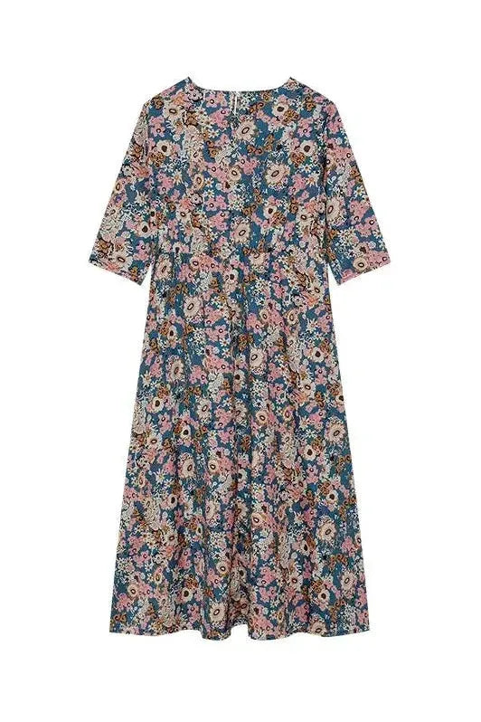 Women's elegant button-front midi dress, a flattering & versatile piece for any occasion, offering timeless style.