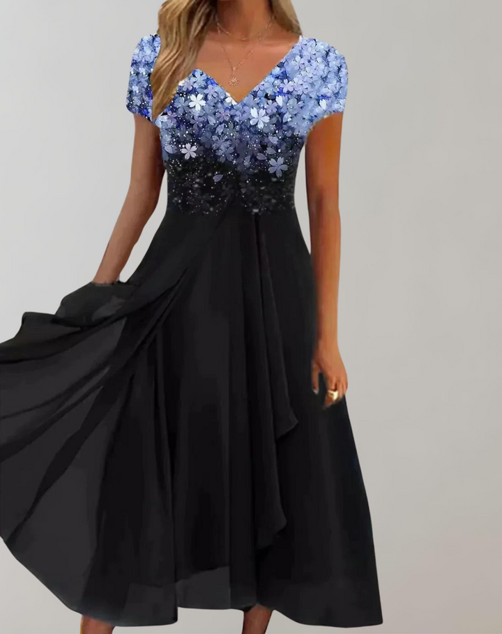 Elegant women's midi dress with intricate floral embellishments, perfect for special occasions & formal events.