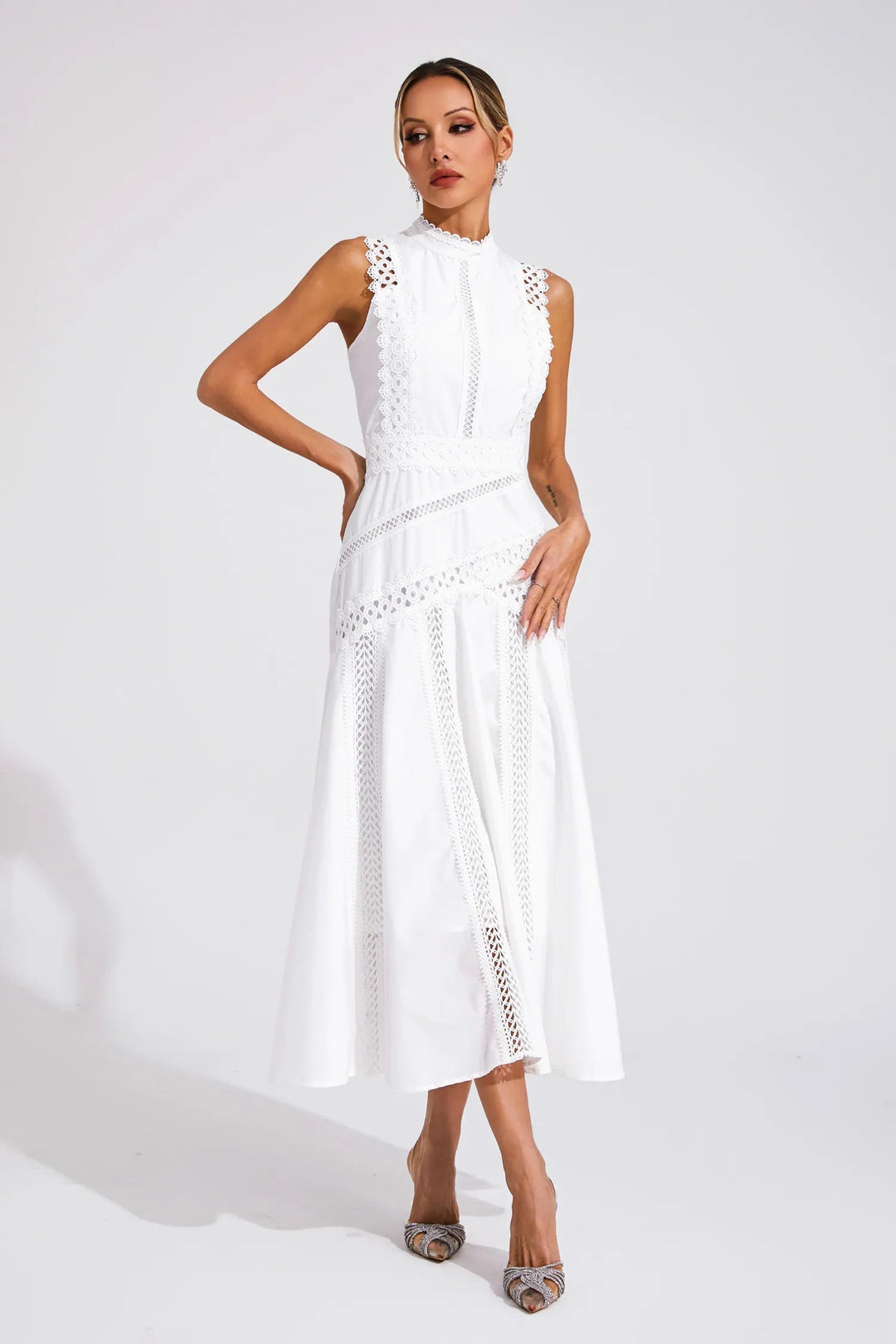 Sophisticated mock neck lace midi dress for women, featuring intricate cutwork details for parties.