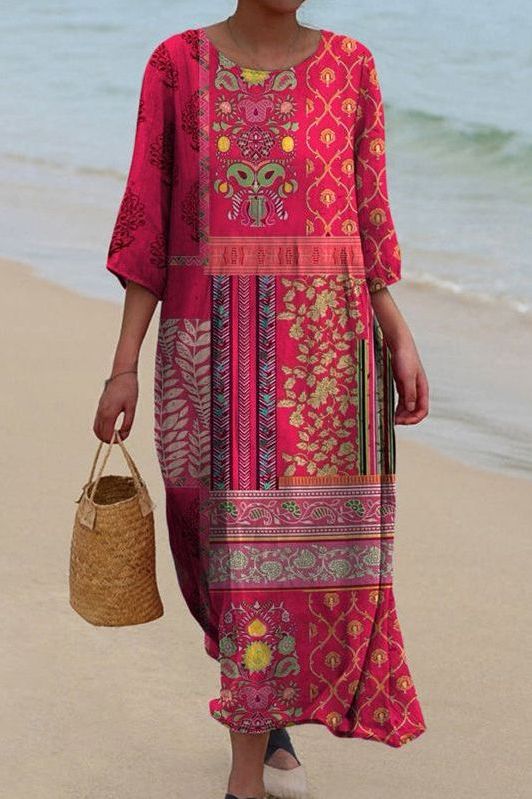 Elegant women's multicolored pleated maxi dress, flowing for special occasions. Comfortable evening gown style.