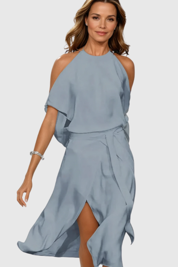 Chic women's off-shoulder asymmetric midi dress. Modern, versatile formal wear for parties or elegant evening occasions.