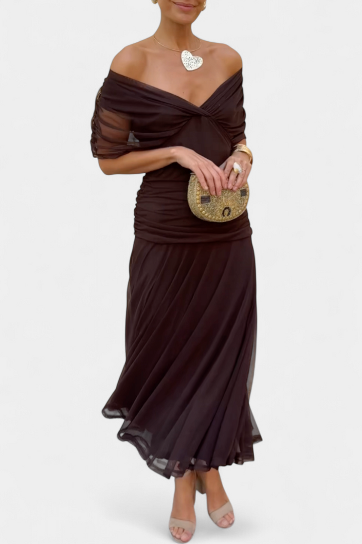 Sophisticated women's off-shoulder evening gown, a draped maxi dress in a flattering fit. Special occasion wear.