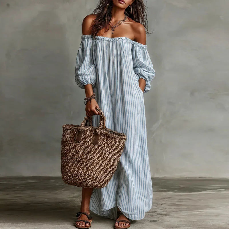 Long off-shoulder summer dress for women, featuring a flowy silhouette and delicate puff sleeves.