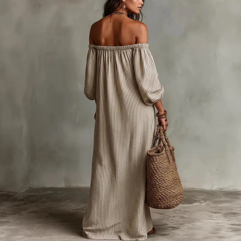 Flowy off-shoulder maxi dress for women, featuring chic puff sleeves, ideal for spring fashion.
