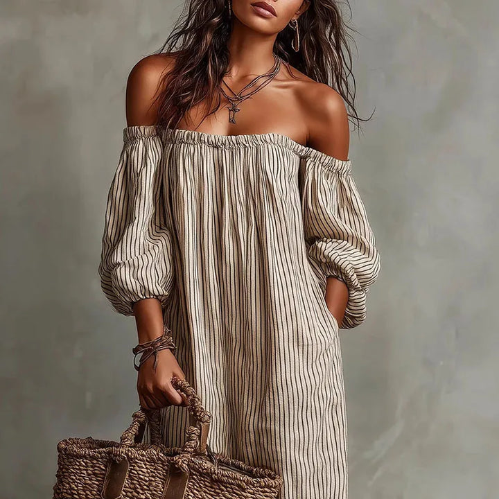 Casual yet elegant women's maxi dress with an off-shoulder neckline and stylish puff sleeves.