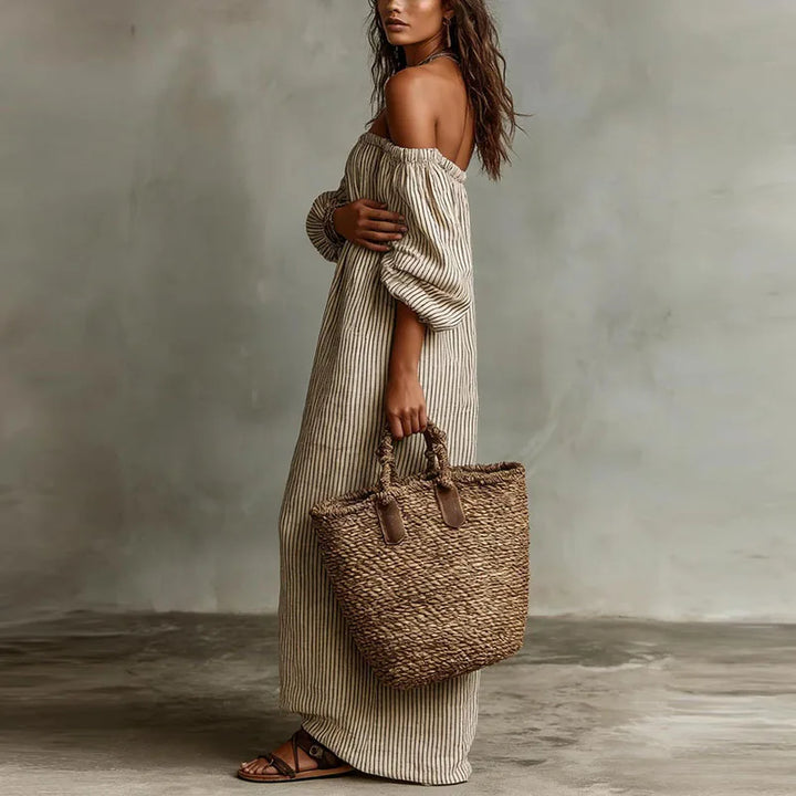 Beautiful women's day dress: off-shoulder, flowy maxi style with trendy puff sleeves.