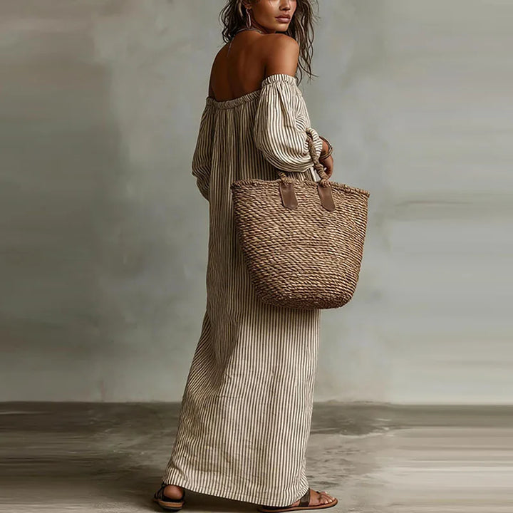 Versatile women's off-shoulder maxi dress with puff sleeves, suitable for casual & elegant occasions.
