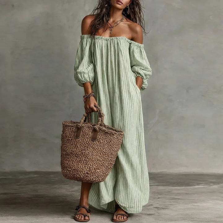 Effortless women's off-shoulder maxi dress with comfortable puff sleeves, great for spring/summer.