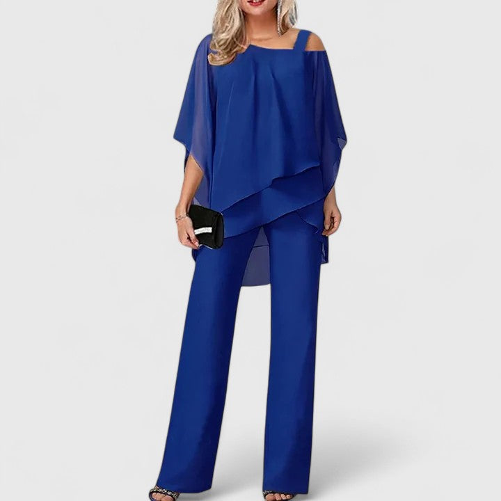 Sophisticated off-shoulder cape top from a women's two-piece formal set, ideal for wedding guests.
