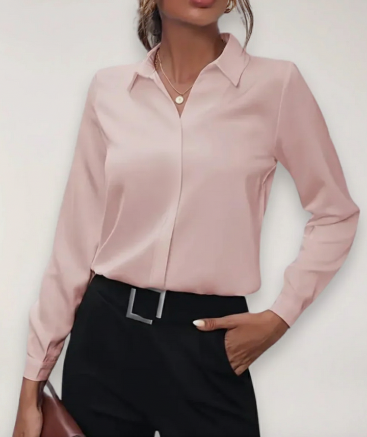 Professional women's button-down blouse, a stylish long-sleeve top ideal for work, office, or formal attire.