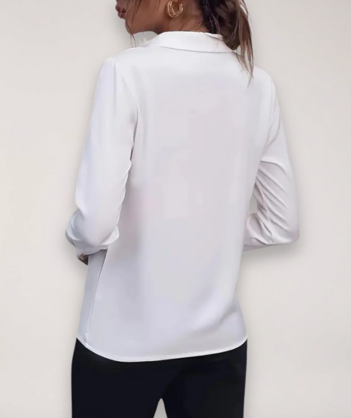 Elegant women's long-sleeve button-down blouse, a professional work shirt perfect for business and office wear.