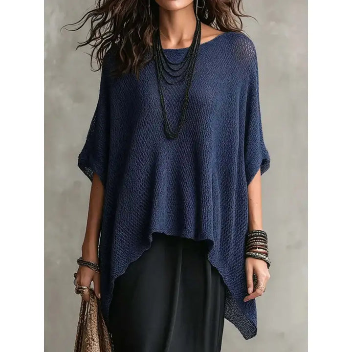 Stylish dark blue women's boat neck poncho top with draped design. Comfortable loose fit pullover for elegant casual wear.