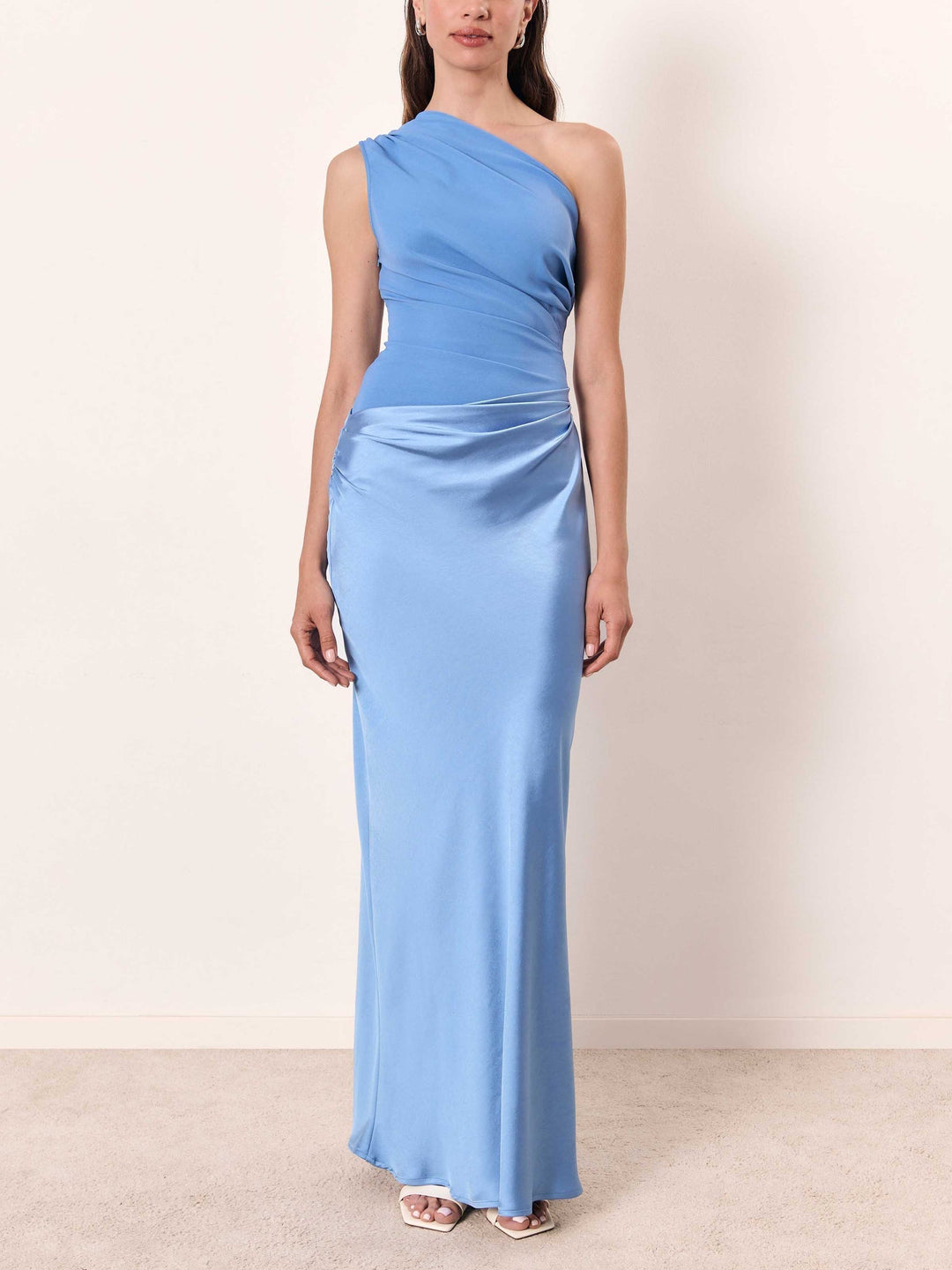 Flowing women's one-shoulder pleated maxi formal dress, an elegant choice for evening wear.