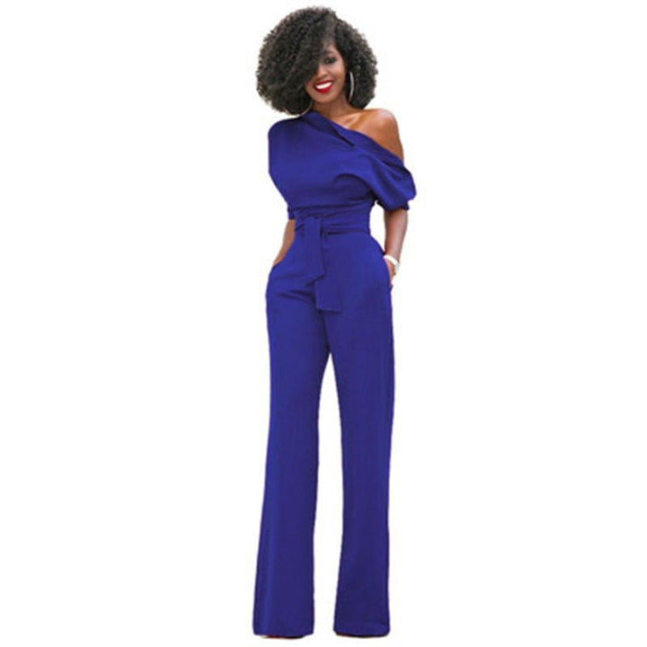 Close-up of elegant one-shoulder women's jumpsuit, highlighting the modern neckline. Versatile for party or evening.