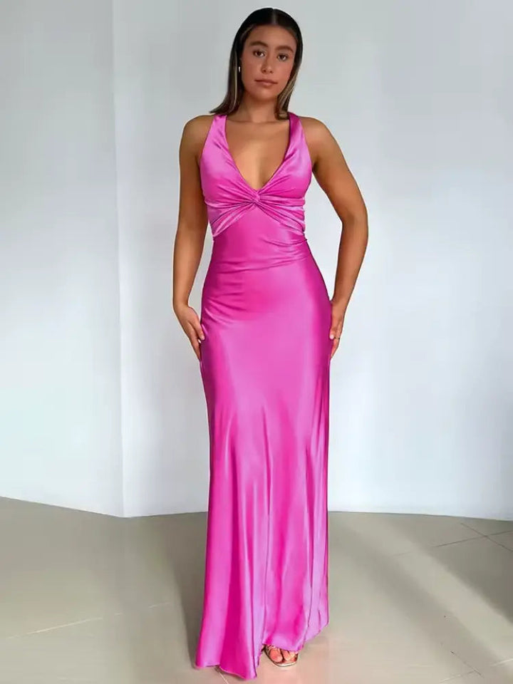 Stylish women's maxi dress, an elegant choice for parties or summer evenings, featuring a halter neck and open back.