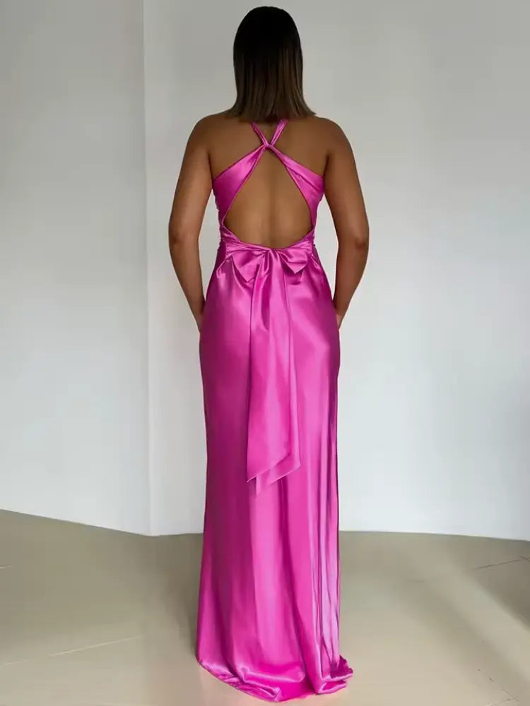 Women's maxi dress with an elegant halter neck and stylish open back, perfect for special occasions or evening wear.