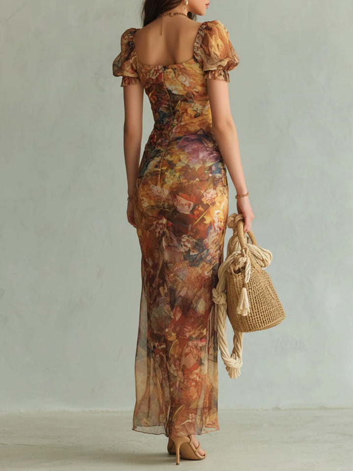 Orange floral print ruched maxi dress for women featuring a sweetheart neckline and puff sleeves. Ideal evening wear.