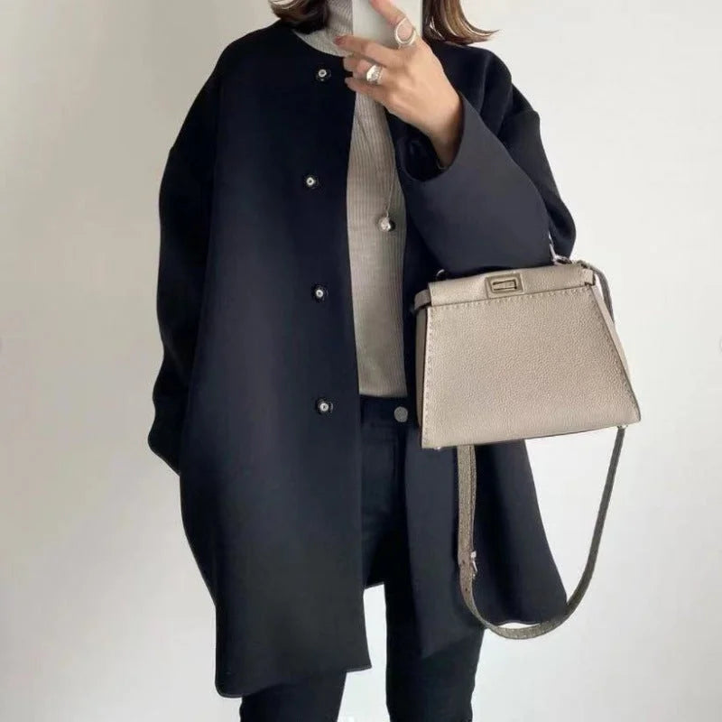 Versatile women's beige oversized button coat, a chic layering piece for casual or office wear.