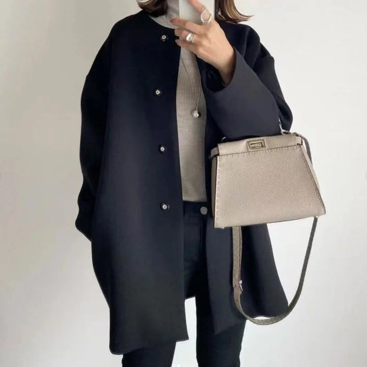 Versatile women's beige oversized button coat, a chic layering piece for casual or office wear.