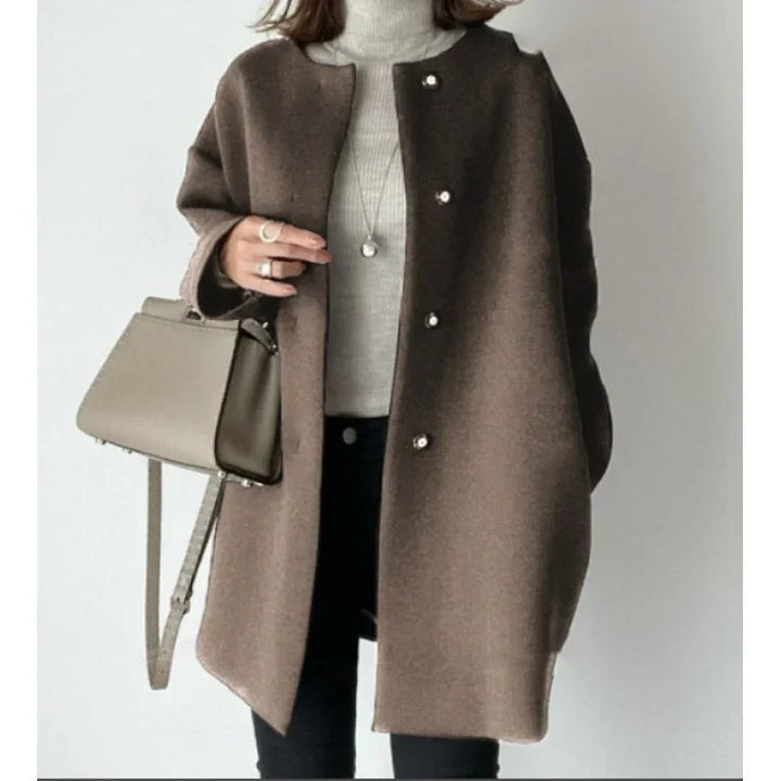 Stylish brown long button coat for women, ideal elegant outerwear for fall and winter.