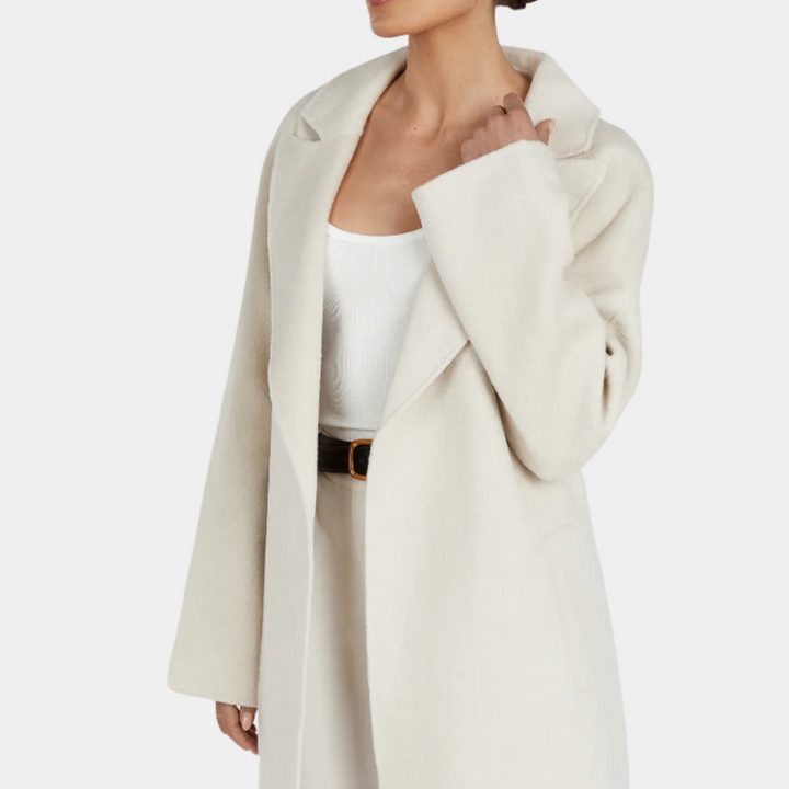 Stylish oversized women's trench coat, long and belted, featuring a modern, elegant design. Ideal for spring/fall.