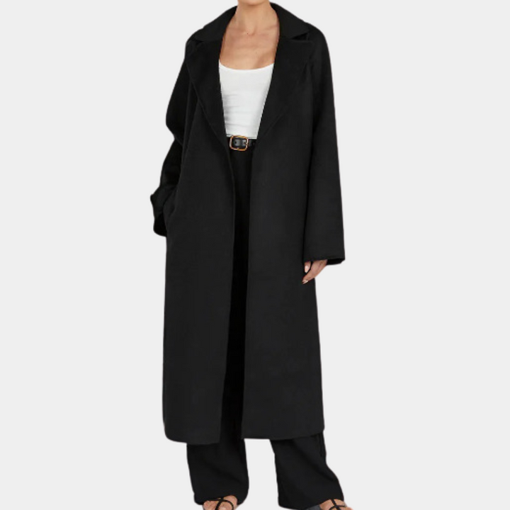 Chic women's oversized trench coat with an elegant belt. This long jacket offers versatile and modern fall/spring style.