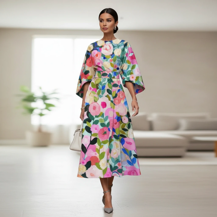 A-line floral print midi dress with chic puff sleeves. Stylish summer or cocktail occasion wear for women.