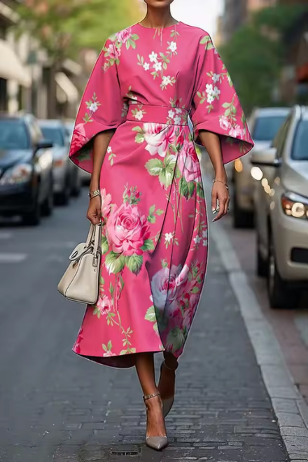 Versatile women's floral midi dress with puff sleeves, suitable as a wedding guest dress or party wear.