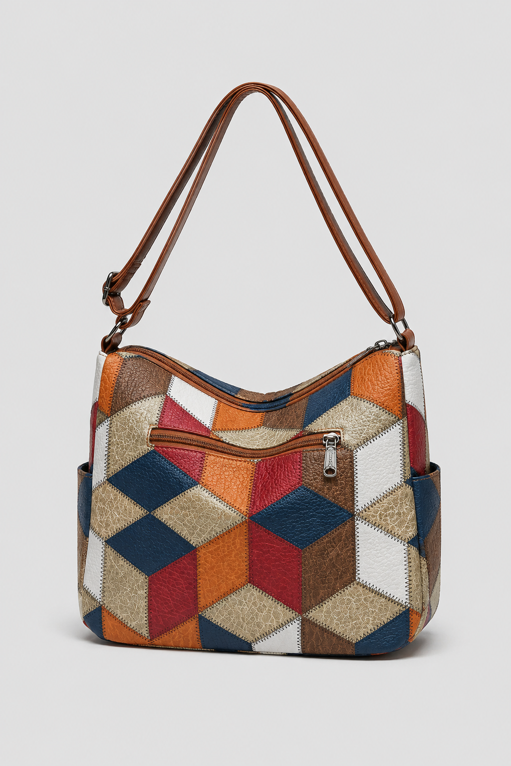 Stylish women's patchwork shoulder bag, featuring unique fabric textures and an elegant, artistic design for fashion.