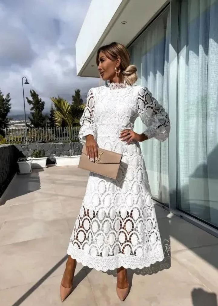 Beautiful patterned long maxi dress for women with elegant design, puff sleeves, & high neck. Perfect for summer.