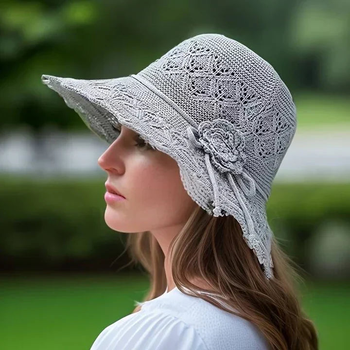 Foldable women's summer sun hat with elegant pattern, perfect for travel, beach days, and sun protection.