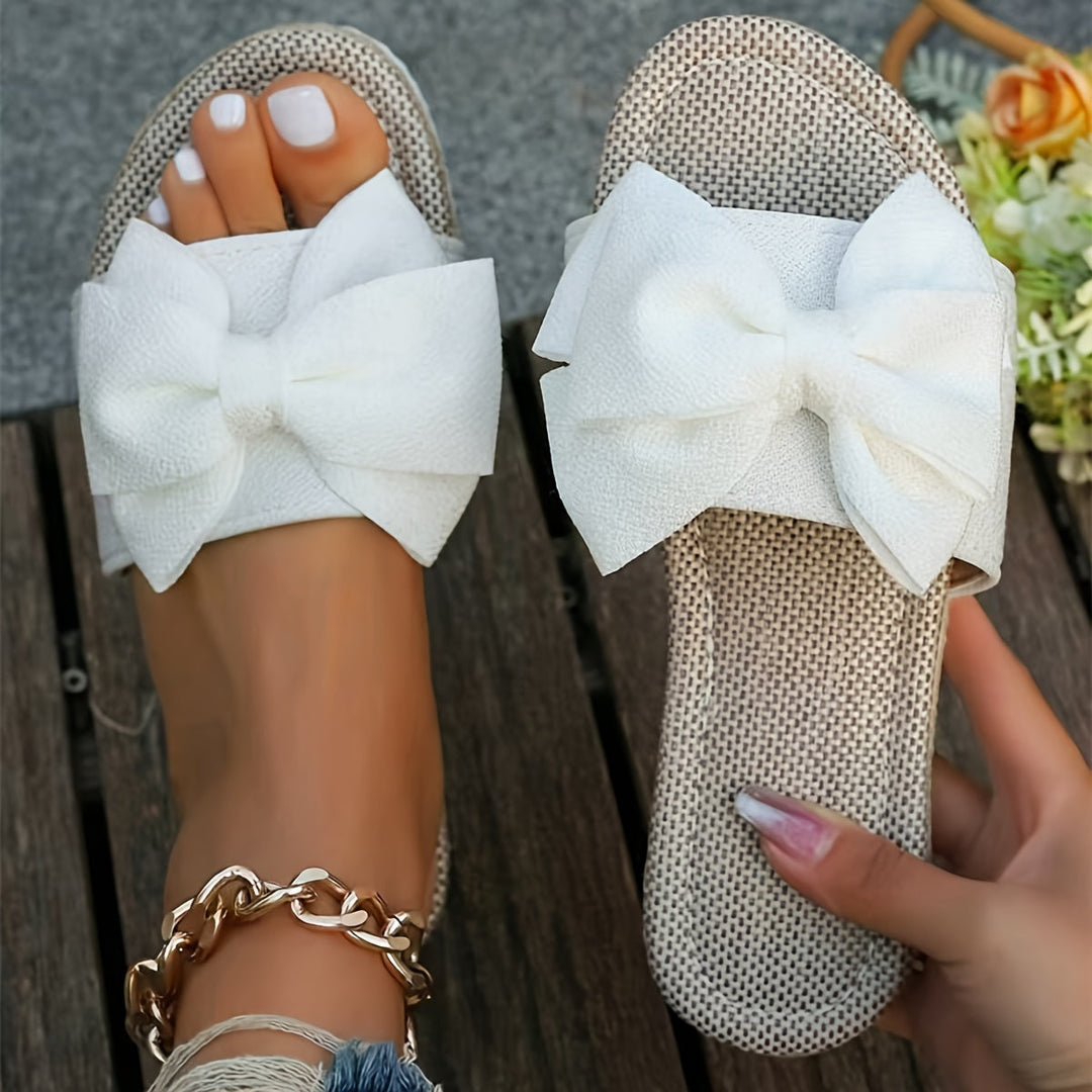 Comfortable flat pearl slide sandals for women, ideal casual summer footwear with an open-toe design.
