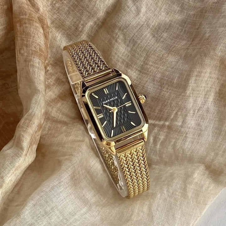 Close-up of a women's elegant petite wristwatch, featuring a sleek, classic design.