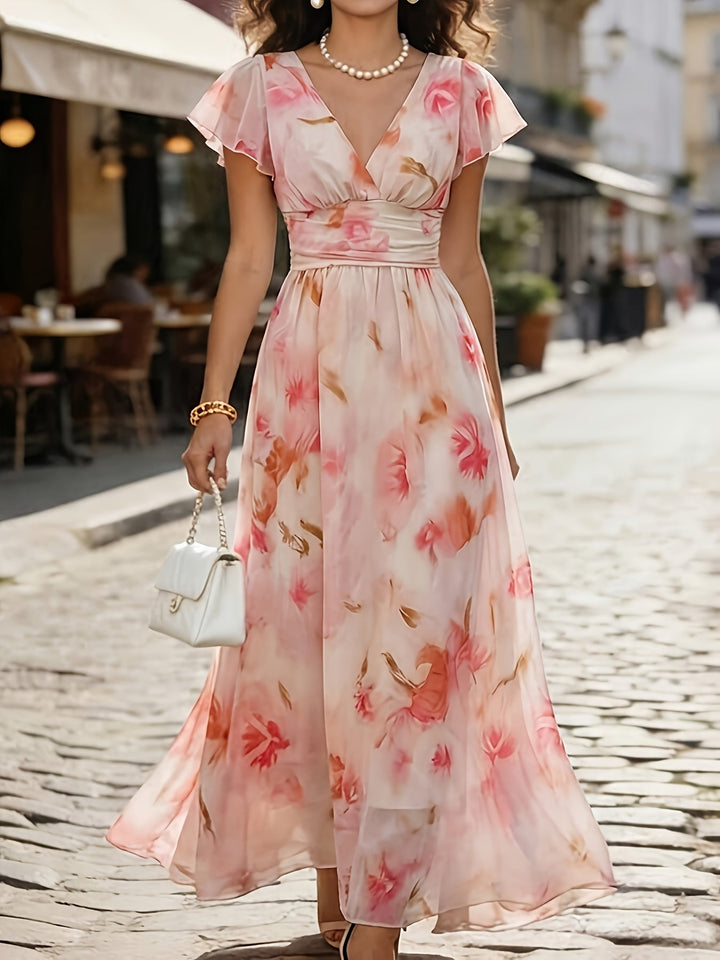 Dreamy pink floral flutter sleeve V-neck flowy maxi dress, ideal for elegant garden parties.